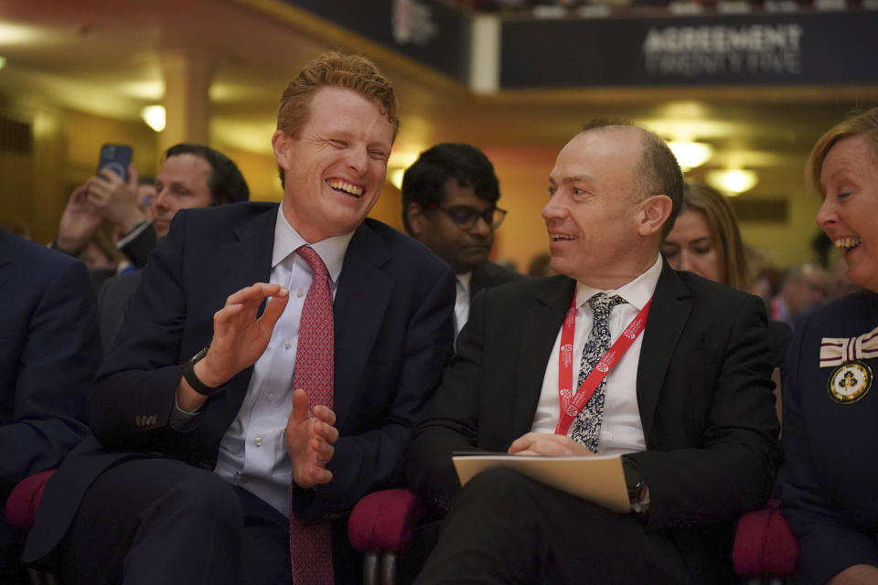 Joe Kennedy III, US Special Envoy for Northern Ireland, left, shares a laugh with Northern Ireland Secretary Chris Heaton-Harris on the first day of a three-day international conference at Queen's University Belfast to mark the 25th anniversary of the Good Friday Agreement, in Belfast, Northern Ireland, Monday, April 17, 2023. Former U.S. President Bill Clinton and past leaders of the U.K. and Ireland are gathering in Belfast on Monday, 25 years after their charm, clout and determination helped Northern Ireland strike a historic peace accord. (Niall Carson/PA via AP)