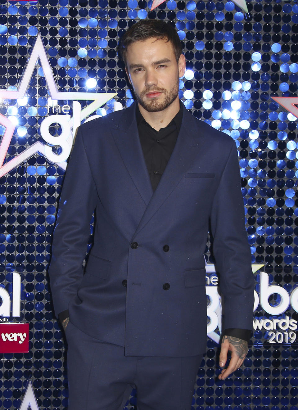 FILE - In this March 7, 2019, file photo, former One Direction singer Liam Payne arrives at the Global Gift Gala in London. The coronavirus has halted many plans in the music industry but it didn’t stop Grammy-nominated DJ-producer Alesso and Payne from filming a music video for the new dance song “Midnight,” released on Wednesday. (Photo by Joel C Ryan/Invision/AP, File)