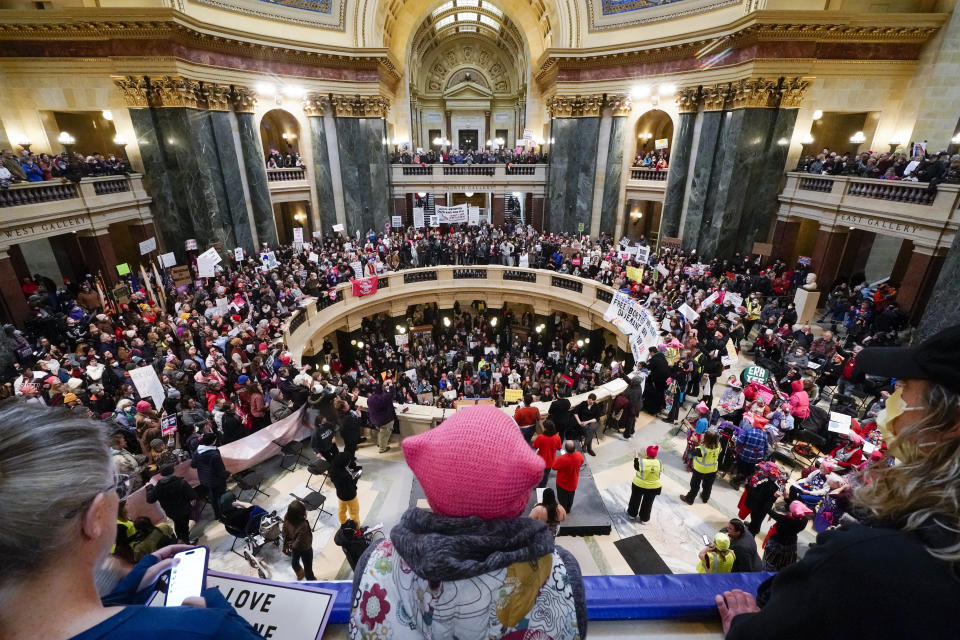 Protesters are seen in the Wisconsin Capitol Rotunda during a march supporting overturning Wisconsin's near total ban on abortion Sunday, Jan. 22, 2023, in Madison, Wis. (AP Photo/Morry Gash)