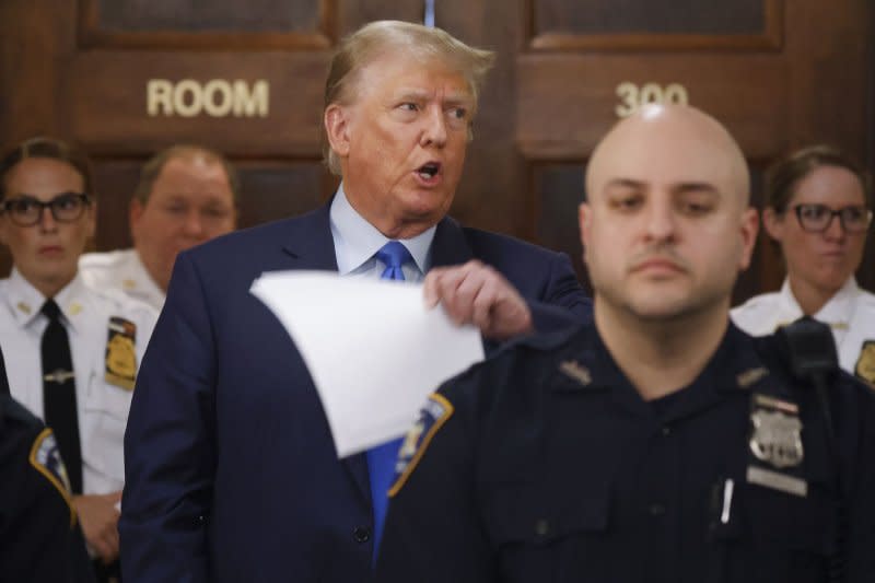 Former United States President Donald Trump speaks while court is on a lunch break on the opening day of his civil fraud trial on Monday in New York City. Photo by John Angelillo/UPI