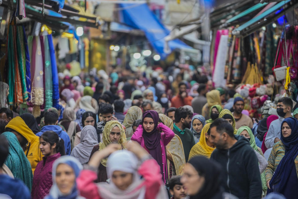 Kashmiri Muslims shop ahead of Eid al-Fitr in Srinagar, Indian controlled Kashmir, Tuesday, April 18, 2023. Eid al-Fitr, marks the end of the fasting month of Ramadan. (AP Photo/Mukhtar Khan)