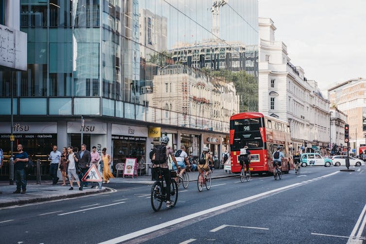 Ministers are promoting public transport use, walking, and cycling. <a href="https://www.shutterstock.com/image-photo/london-uk-july-24-2018-cyclists-1169581654" rel="nofollow noopener" target="_blank" data-ylk="slk:Alena Veasey/Shutterstock;elm:context_link;itc:0;sec:content-canvas" class="link rapid-noclick-resp">Alena Veasey/Shutterstock</a>