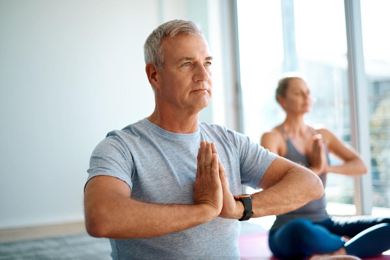 middle-aged man doing yoga