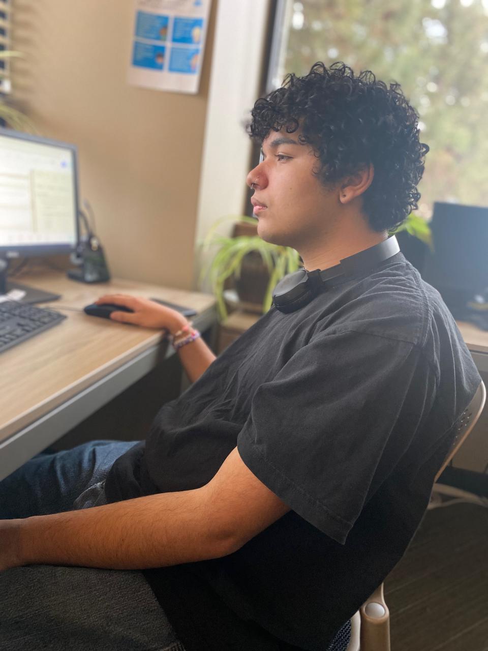 Eddie Lopez, 17, of Bend, Ore., responds to a text from a young person who said they felt unloved on February 7, 2024.