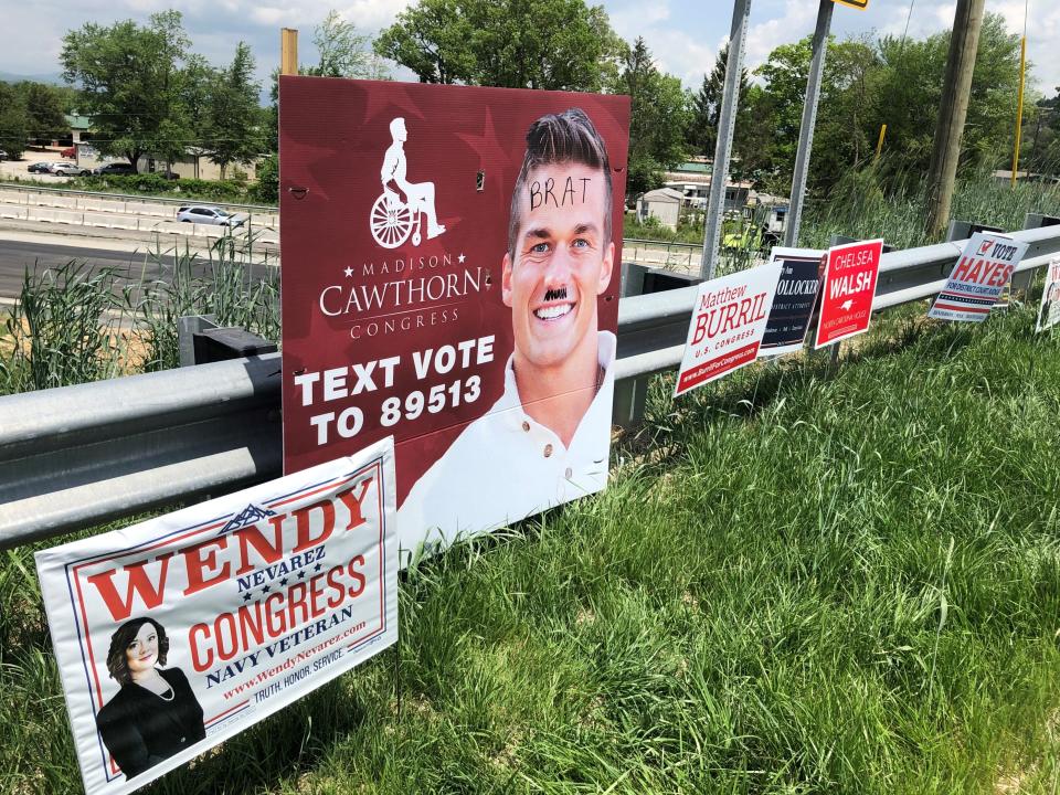 Readers ask if oversized Madison Cawthorn for Congress signs placed by roadways in the mountains are illegal. This one, located in northern Henderson County on Butler Bridge Road, had been defaced, which is also a violation of the law.