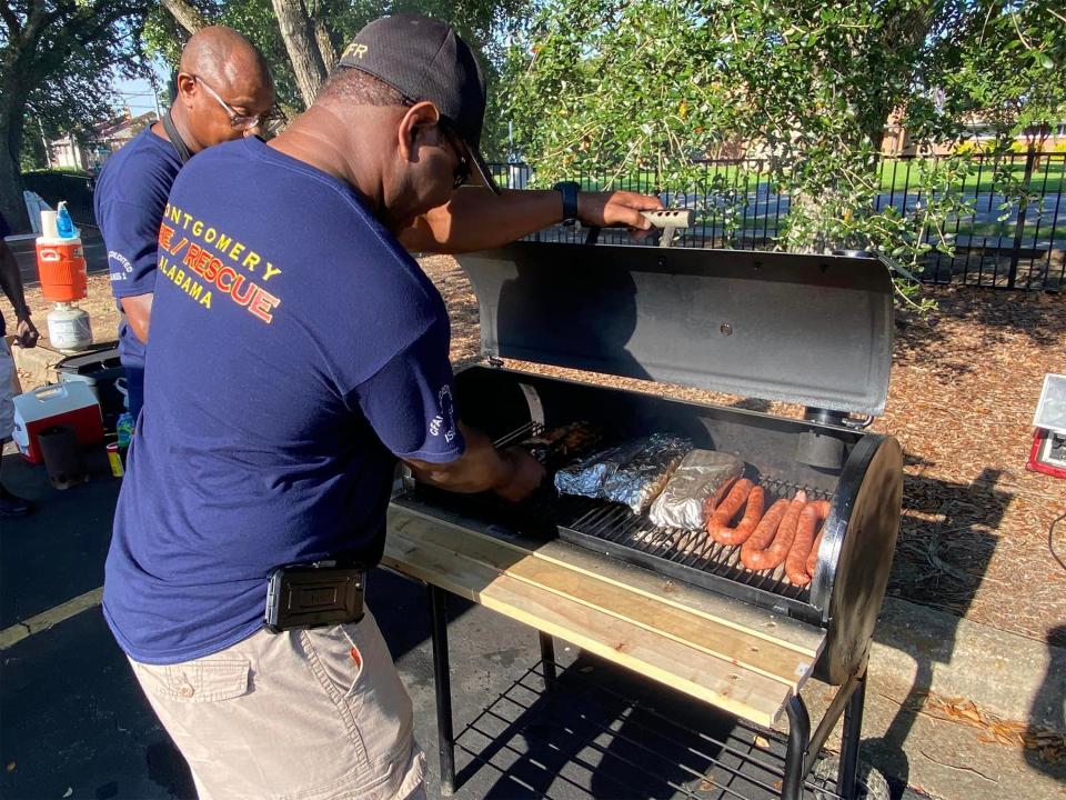 Montgomery Fire/Rescue mans the grill at the 2022 Midtown YMCA Tailgate BBQ Cookoff.