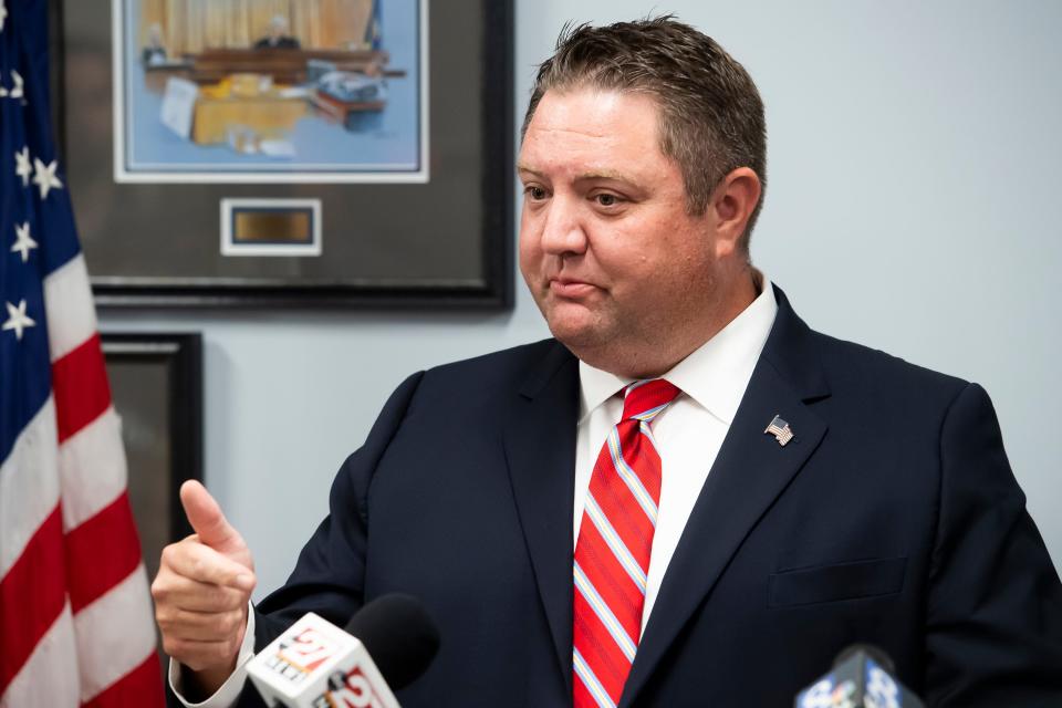 Adams County District Attorney Brian Sinnett answers questions from the press during a news conference on July 27, 2021.