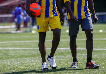 Asylum seekers take part in the soccer tournament "All on the pitch" organised by NGO's and Belgian Football Association at the occasion of the World Refugee Day, in Deurne, Belgium June 20, 2018. REUTERS/Yves Herman