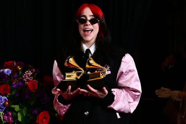 <p>FREDERIC J. BROWN/AFP via Getty Images</p> Billie Eilish poses with her Grammy awards at the 2024 ceremony.