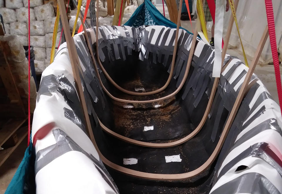 Katy Ayers and Ash Gordon sandwiched the boat's skeleton with mushroom spawn and let nature take over. (Courtesy Katy Ayers)