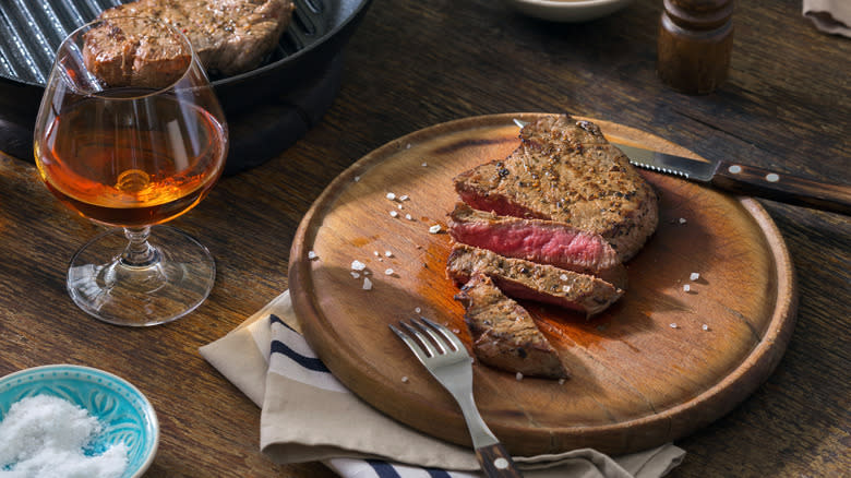 Steak with glass of whiskey