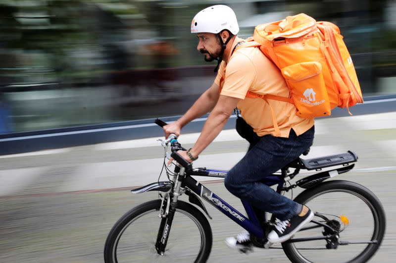 Former Afghan Communication Minister Sadaat works as a bicycle rider for the food delivery service Lieferando in Leipzig