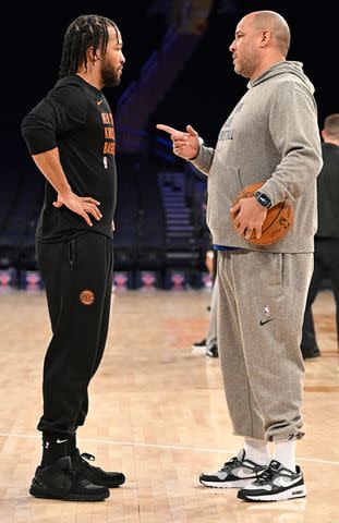 <p>David Dow/NBAE via Getty</p> Jalen Brunson and his dad, Rick Brunson, on the court at Madison Square Garden in February 2024.