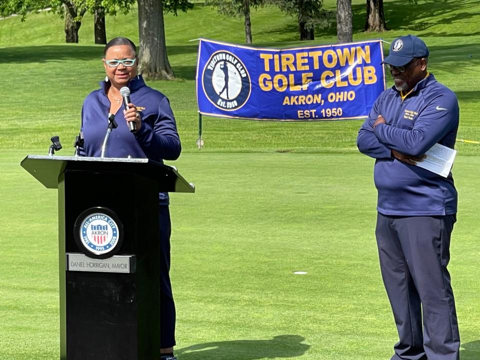 Judi Hill, president of the Akron branch of the NAACP, and Ralph Paulk, president of Tiretown Golf Club, talk Saturday morning at Akron's Good Park Golf Course.