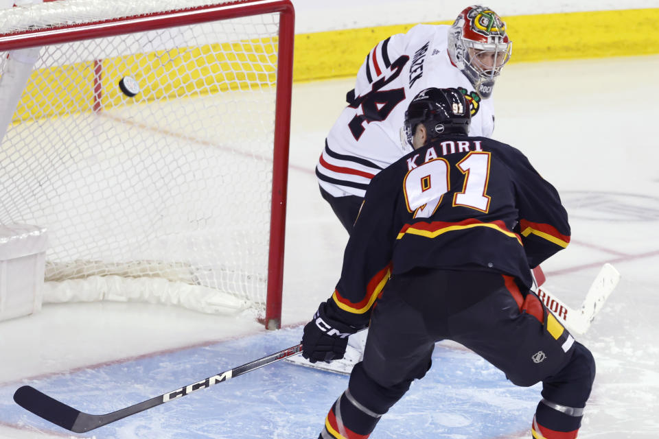 Calgary Flames Nazem Kadri misses an open net against Chicago Blackhawks goalie Petr Mrazek during the third period of an NHL hockey game Saturday, Jan. 27, 2024, in Calgary, Alberta. (Larry MacDougal/The Canadian Press via AP)