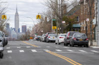 The Empire State building is seen in the distance from an empty street, Thursday, April 2, 2020, in the Brooklyn borough of New York. The new coronavirus causes mild or moderate symptoms for most people, but for some, especially older adults and people with existing health problems, it can cause more severe illness or death. (AP Photo/Mary Altaffer)