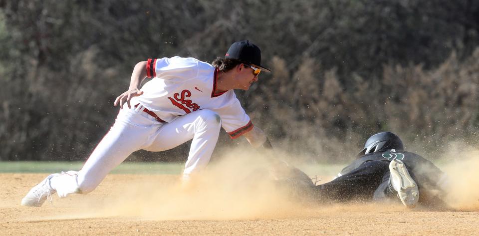 Andrew Kapica of Somers tags out Niko DiStasio of Yorktown on a caught stealing in the first inning of a varsity baseball game at Somers High School April 12, 2023. Somers defeated Yorktown 14-4 in five innings. 