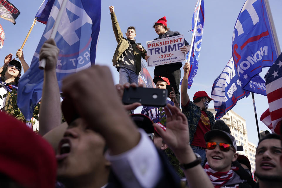 FILE - Supporters of President Donald Trump attend a pro-Trump march Saturday Nov. 14, 2020, in Washington. On Friday, Nov. 20, The Associated Press reported on stories circulating online incorrectly claiming more than 1 million people took part in the "Million MAGA March" in Washington. (AP Photo/Jacquelyn Martin, File)