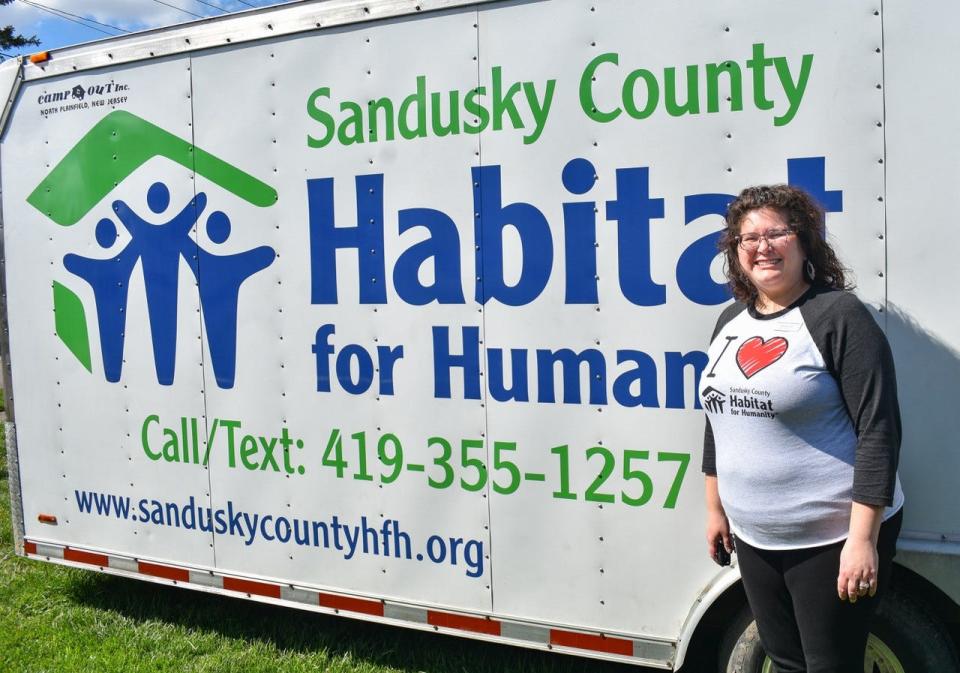 Sandusky County Habitat for Humanity Executive Director Pam Kensler stands next to the organization’s trailer which was recently wrapped with the support of 419 Signs. The trailer highlights Habitat’s work in the community, provides contact information, and is a visual indication of a building site.