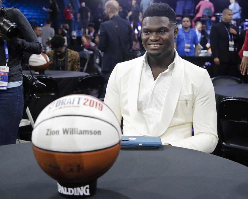 Zion Williamson, of Duke, smiles before the NBA basketball draft Thursday, June 20, 2019, in New York. (AP Photo/Julio Cortez)