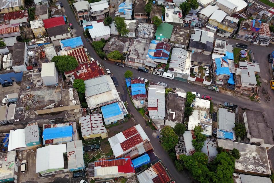 Blue tarps given out by FEMA cover several roofs two years after Hurricane Maria affected the island in San Juan, Puerto Rico, September 18, 2019.