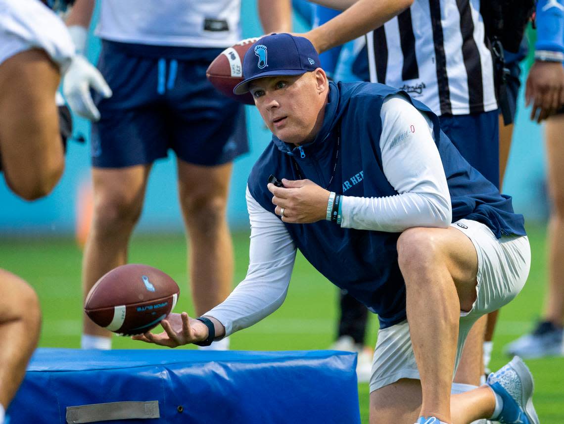 North Carolina defensive coordinator Geoff Collins works with his players during the Tar Heels’ first practice of the season on Monday, July 29, 2024 in Chapel Hill, N.C.