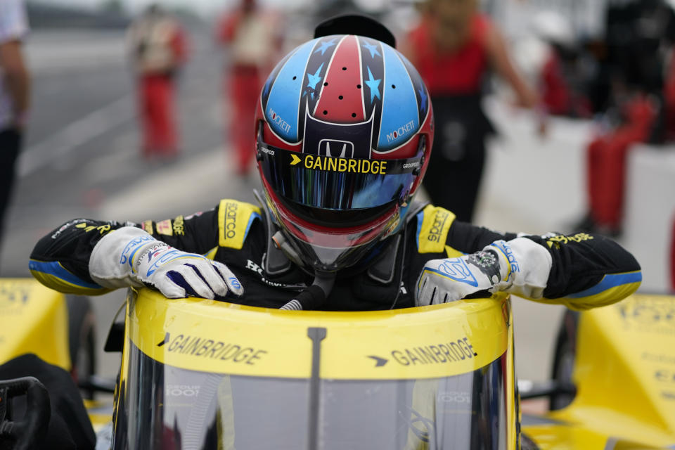 Colton Herta climbs out of his car during qualifications for the Indianapolis 500 auto race at Indianapolis Motor Speedway, Saturday, May 22, 2021, in Indianapolis. (AP Photo/Darron Cummings)