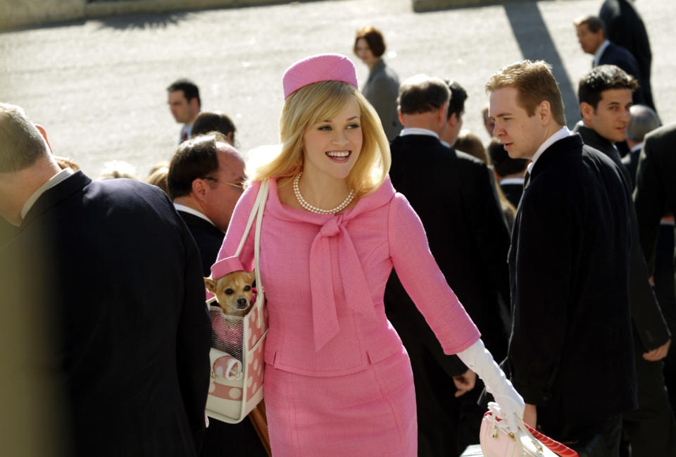 Elle wears a pink suit to court, and Bruce has a matching hat