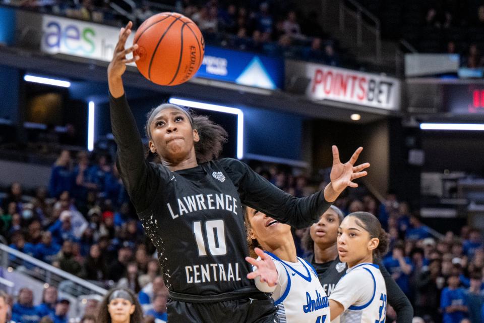 Lawrence Central High School junior Jaylah Lampley (10) pulls down a rebound during the second half of an IHSAA class 4A girls’ basketball state finals game against Lake Central high School, Saturday, Feb. 24, 2024, at Gainbridge Fieldhouse, in Indianapolis. Lawrence Central won the school’s first state championship title in girl’s basketball.