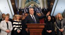 Liberal leader Philippe Couillard speaks to the media after Quebec's Premier Pauline Marois called an election at the National Assembly in Quebec City, March 5, 2014. Quebec voters will head to the poll for a provincial election on April 7. REUTERS/Mathieu Belanger (CANADA - Tags: POLITICS ELECTIONS)