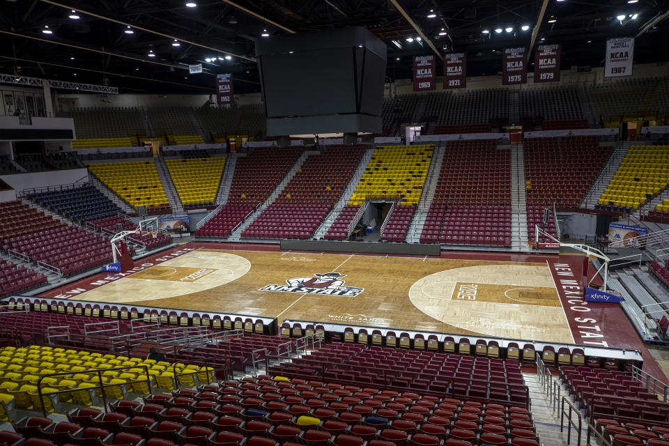 FILE - The basketball court of the Pan American Center at New Mexico State University is pictured, Feb. 15, 2023, in Las Cruces, N.M. A review of hundreds of emails provide insight into the damage control done by top administrators at New Mexico State after news broke earlier in the year about allegations of hazing on the men's basketball team. More than 2,400 pages of documents released by the university in response to a records request by The Associated Press also show the disappointment and anger by fans and alumni over what many referred to as a “black eye” for the school. (AP Photo/Andrés Leighton, File)