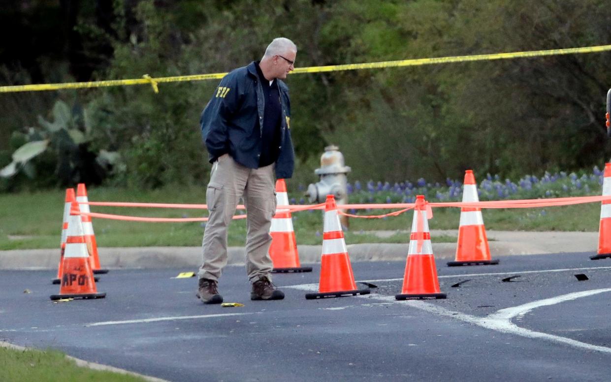 Officers at work at the scene of a fourth explosion in Austin, Texas - AP