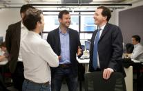 British finance minister George Osborne (right) joined entreprenuers at the opening of the first campus in London in 2012