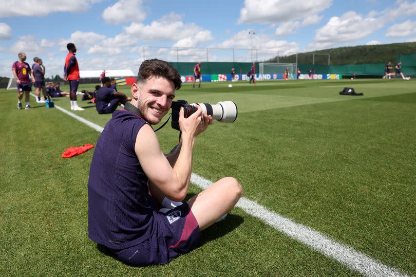 Declan Rice of England takes photos during a training session at Spa & Golf Resort Weimarer Land on June 18, 2024 in Blankenhain, Germany.