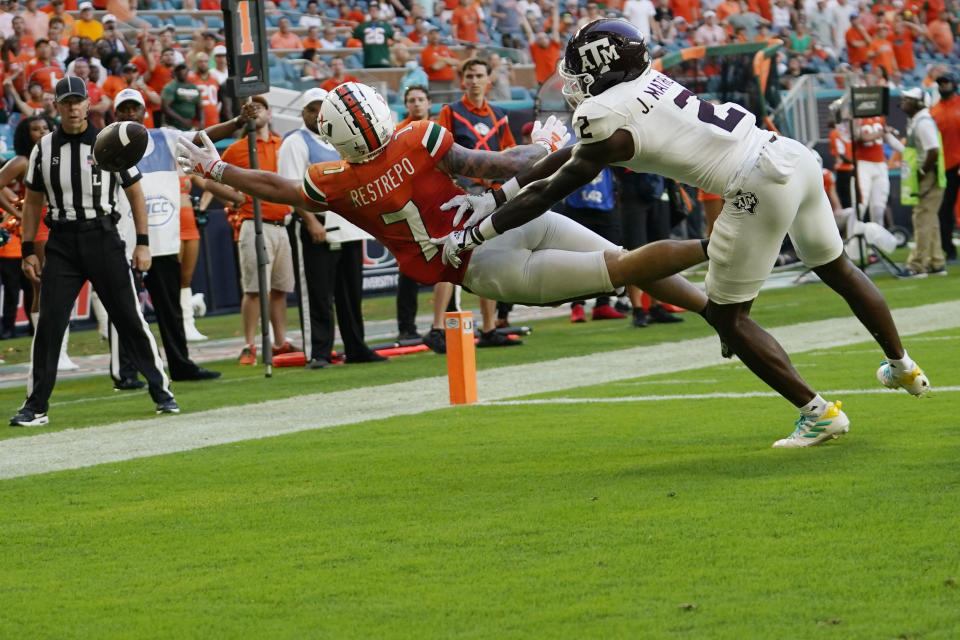 Miami Hurricanes wide receiver Xavier Restrepo (7) can't make a catch as Texas A&M defensive back Jacoby Matthews (2) defends during the second half of an NCAA college football game Saturday, Sept. 9, 2023, in Miami Gardens, Fla. (AP Photo/Lynne Sladky)
