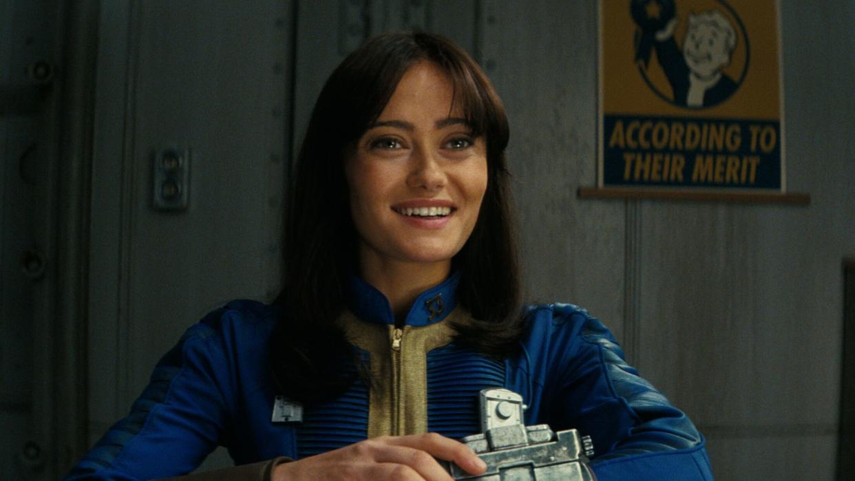  Ella Purnell wearing a Pip-Boy in Fallout. 