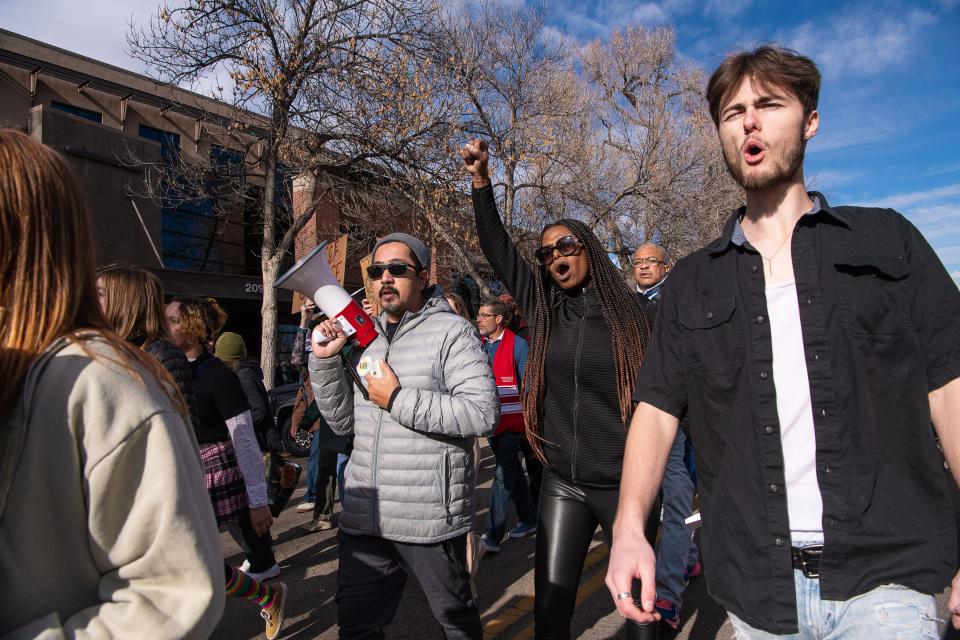 Community members take part in the annual Martin Luther King Jr. Day march along South Meldrum Street on Monday, Jan. 16, 2023, in Fort Collins, Colo.