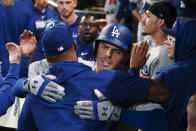 Los Angeles Dodgers. Freddie Freeman, center right, embraces a teammate after hitting a three-run home run against his former team, the Atlanta Braves, in the fifth inning of a baseball game, Monday, May 22, 2023, in Atlanta. (AP Photo/John Bazemore)