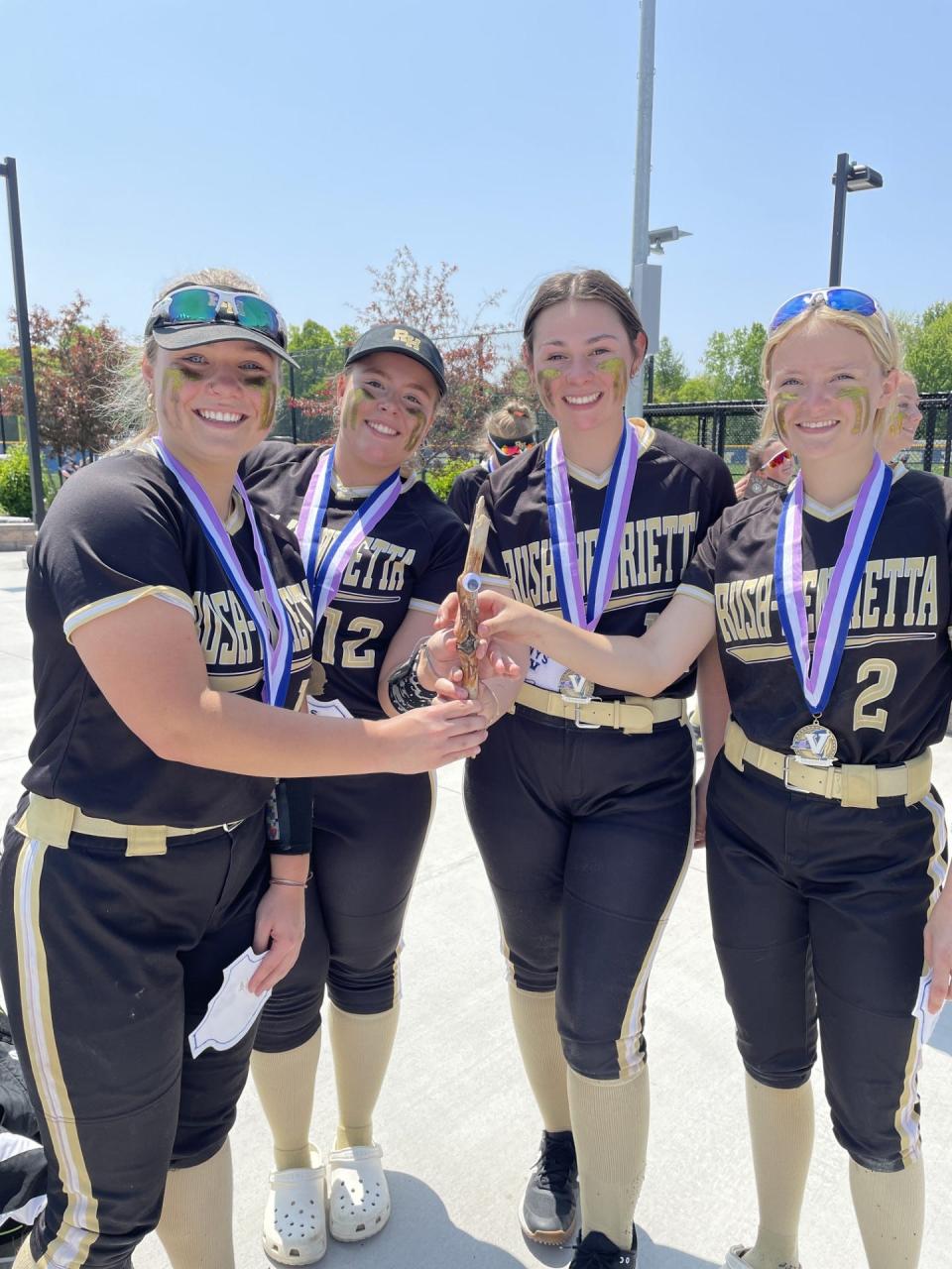 Rush-Henrietta hangs out with "Sticky" after winning the program's first Section V Class AA title.