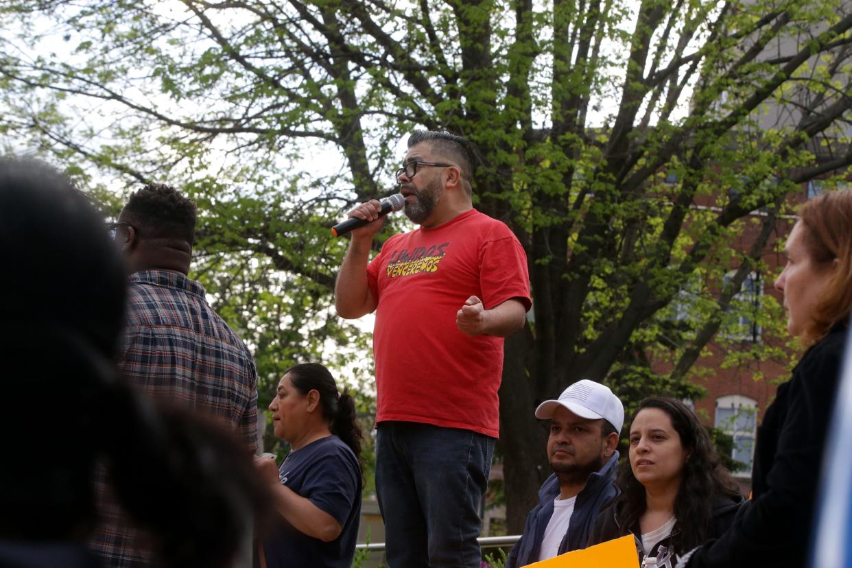 Manny Gálvez, center, speaks to the crowd as members of Escucha Mi Voz gathered at Iowa City City Hall after marching in protest of a new state immigration law Wednesday, May 1, 2024 in Iowa City, Iowa.