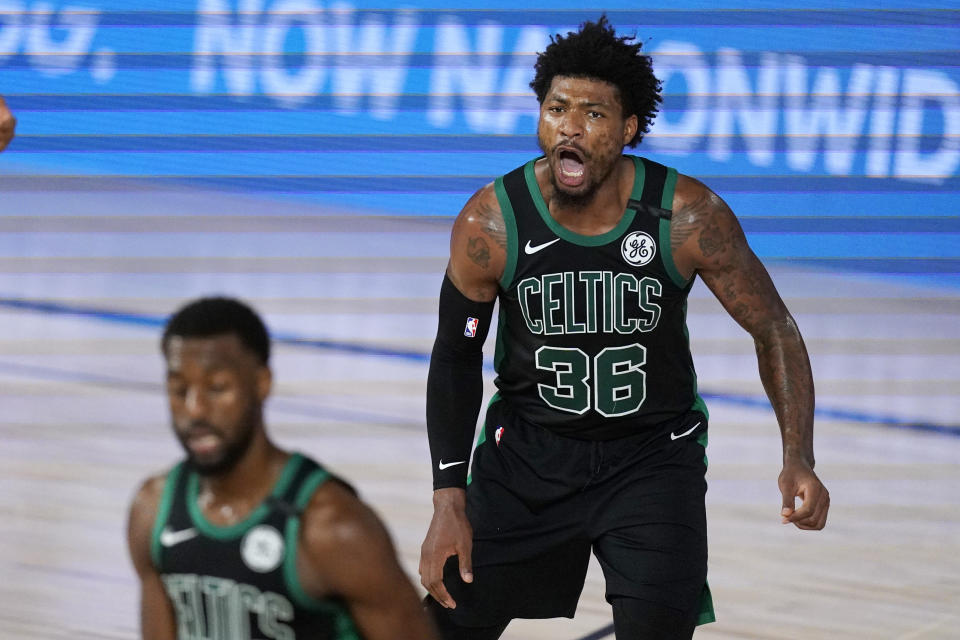 Boston Celtics' Marcus Smart (36) yells to his team after scoring during the first half of an NBA conference semifinal playoff basketball game against the Toronto Raptors' Monday, Sept. 7, 2020, in Lake Buena Vista, Fla. (AP Photo/Mark J. Terrill)