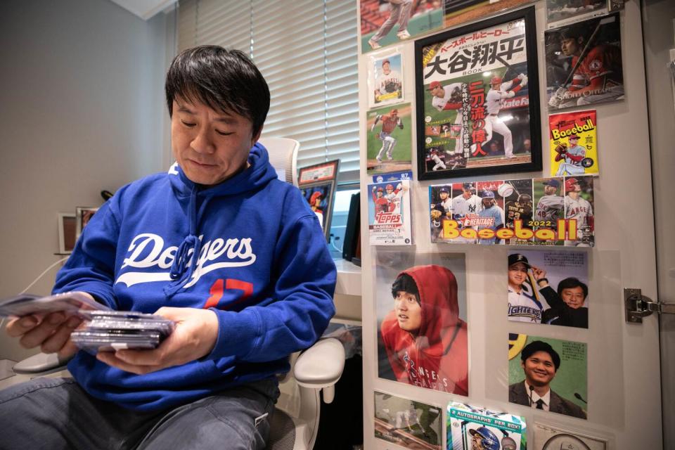 Lee Jae-ik sits among Ohtani memorabilia.