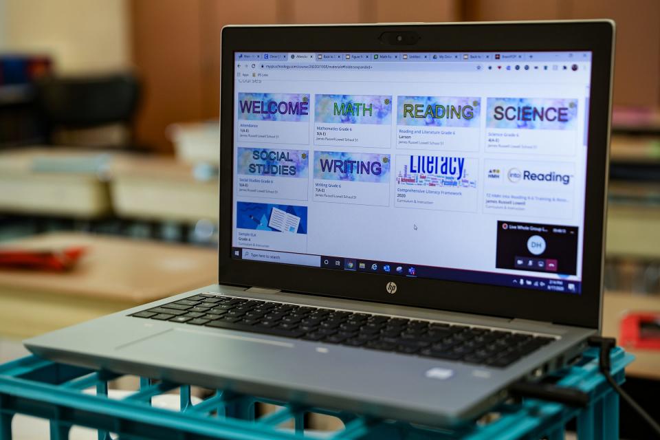 Online coursework subjects are displayed on sixth grade teacher Katy Larson's laptop at James Russell Lowell School 51 in Indianapolis on  Aug. 17. Indianapolis public schools are relying on online instruction until at least October because of the coronavirus pandemic.