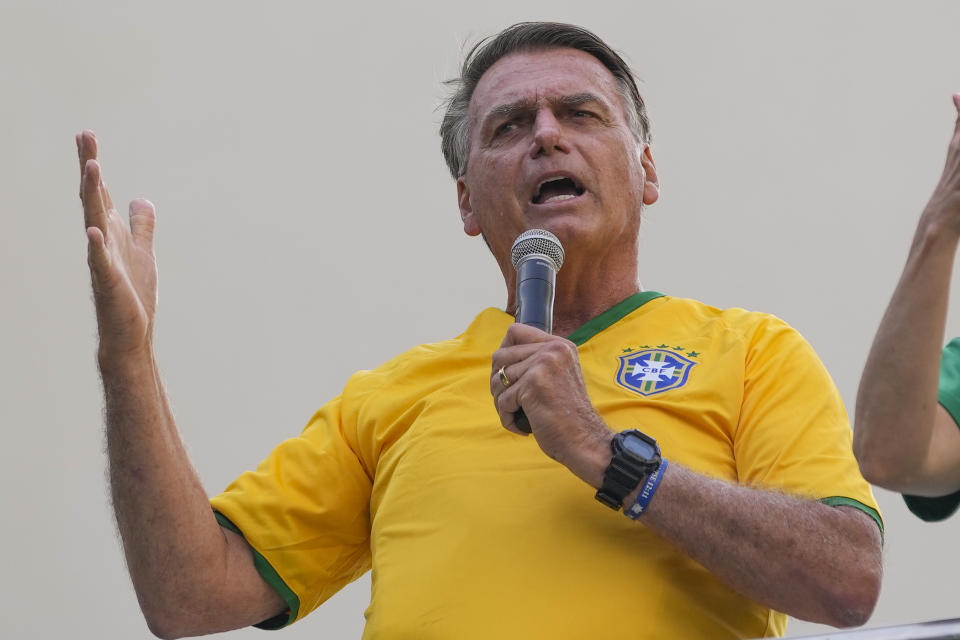 Former President Jair Bolsonaro addresses supporters during a rally in Sao Paulo., Brazil, Sunday, Feb. 25, 2024. Bolsonaro and some of his former top aides are under investigation into allegations they attempted plotted a coup to remove his successor, Luiz Inacio Lula da Silva. (AP Photo/Andre Penner)