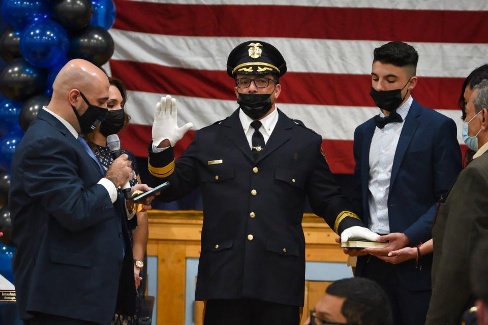 Capt. Ammen Matari is sworn in to the rank of chief of police by Mayor Mohamed Khairullah at Prospect Park School on Brown Avenue in April 2021.