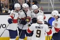 Florida Panthers' Vladimir Tarasenko (10) celebrates his goal against the Boston Bruins with Oliver Ekman-Larsson (91), Evan Rodrigues (17), Anton Lundell (15) and Sam Bennett (9) during the second period in Game 3 of an NHL hockey Stanley Cup second-round playoff series Friday, May 10, 2024, in Boston. (AP Photo/Michael Dwyer)