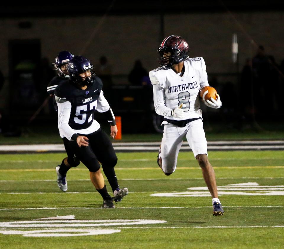 NorthWood senior Jo'Ziah Edmond (8) runs back an interception during the IHSAA Class 4A football semistate championship game against Leo Friday, Nov. 17, 2023, at Leo High School.