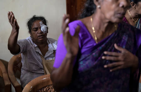 Sumathi Karunakaran, 52, who was injured during the bombing of Zion Church on Easter Sunday, prays at a community hall in Batticaloa, Sri Lanka, May 5, 2019. REUTERS/Danish Siddiqui