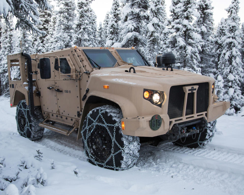 Oshkosh's Joint Light Tactical Vehicle navigates snowy terrain.