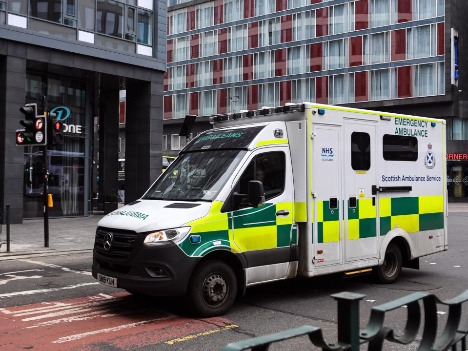 An ambulance travels through Glasgow city centre during the first coronavirus lockdown in March 2020 (AFP via Getty Images)